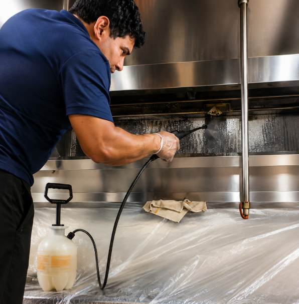 Professional hood cleaning service in action